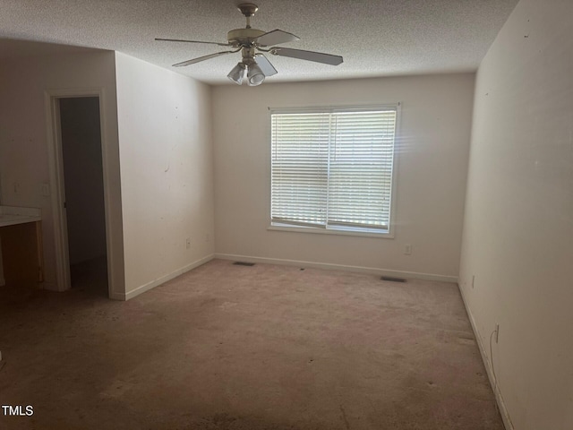 165 Cambridge Elm Dr, Clayton, NC 27520 - spare room featuring light colored carpet, a textured ceiling, and ceiling fan