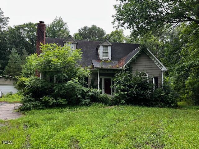 3573 River View Cir, Oxford, NC 27565 - cape cod home with a front yard and a chimney