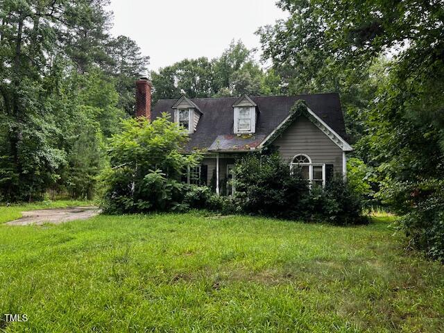 3573 River View Cir, Oxford, NC 27565 - cape cod home with a chimney and a front yard