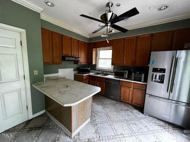 3573 River View Cir, Oxford, NC 27565 - kitchen with stainless steel fridge with ice dispenser, dishwasher, under cabinet range hood, light countertops, and crown molding