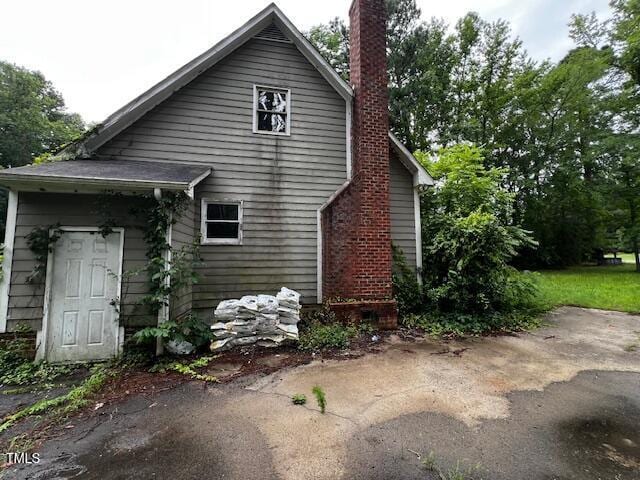 3573 River View Cir, Oxford, NC 27565 - back of property featuring a chimney
