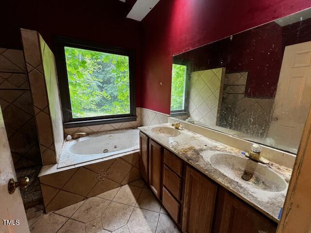 3573 River View Cir, Oxford, NC 27565 - full bathroom featuring a jetted tub, tile patterned flooring, and double vanity
