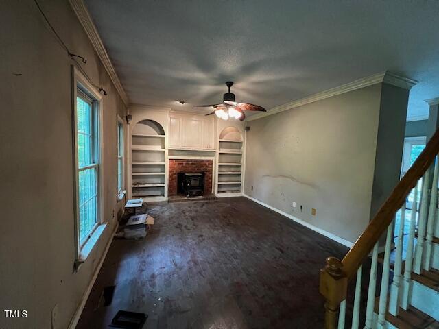 3573 River View Cir, Oxford, NC 27565 - unfurnished living room featuring ornamental molding, a ceiling fan, stairs, and a fireplace