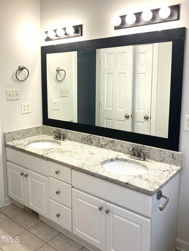 619 Rudy Dr, Clayton, NC 27520 - bathroom featuring double vanity and tile patterned flooring