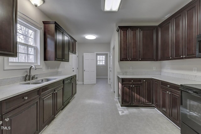 619 Rudy Dr, Clayton, NC 27520 - kitchen featuring stove, dishwashing machine, dark brown cabinets, and light tile patterned flooring
