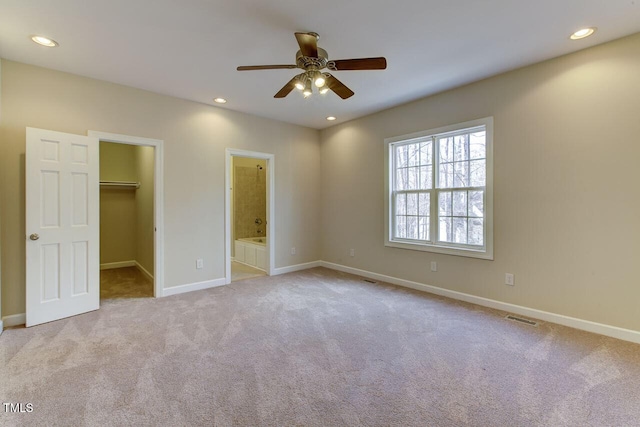 619 Rudy Dr, Clayton, NC 27520 - unfurnished bedroom featuring a spacious closet, carpet, recessed lighting, connected bathroom, and ceiling fan