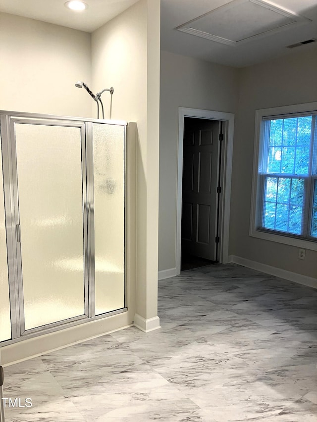 619 Rudy Dr, Clayton, NC 27520 - bathroom featuring a stall shower and baseboards