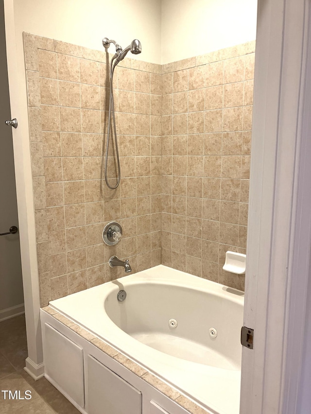 619 Rudy Dr, Clayton, NC 27520 - full bathroom featuring a combined bath / shower with jetted tub and tile patterned flooring