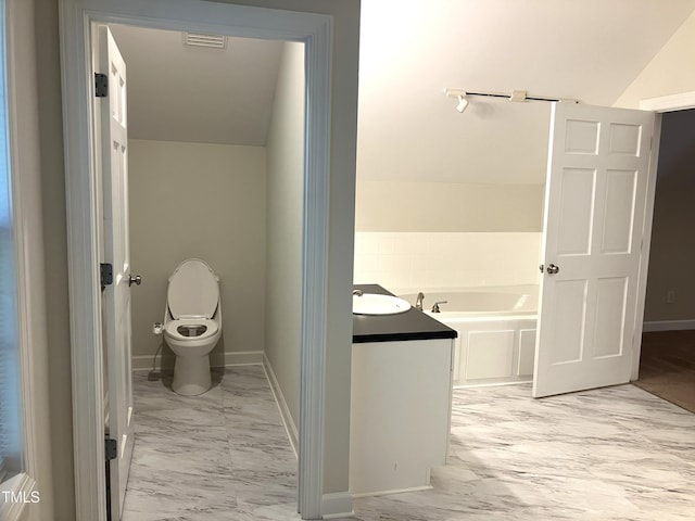619 Rudy Dr, Clayton, NC 27520 - bathroom with marble look tile flooring and a bath