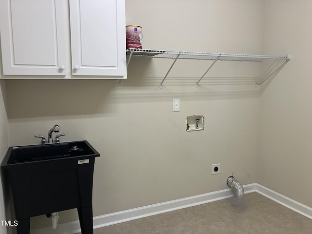 619 Rudy Dr, Clayton, NC 27520 - laundry area featuring cabinet space, washer hookup, electric dryer hookup, and tile patterned floors