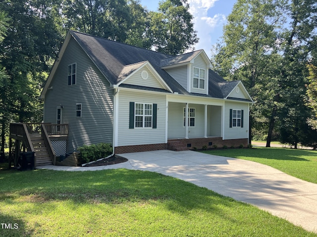 619 Rudy Dr, Clayton, NC 27520 - view of front facade with stairway, crawl space, a front lawn, a wooden deck, and driveway