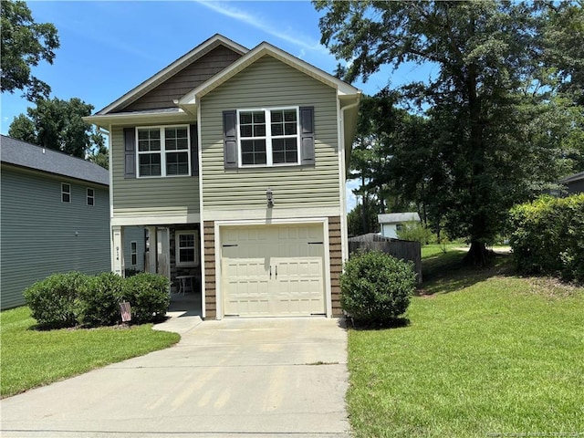 914 W Rowan St SW, Fayetteville, NC 28301 - view of front facade featuring driveway, an attached garage, and a front lawn