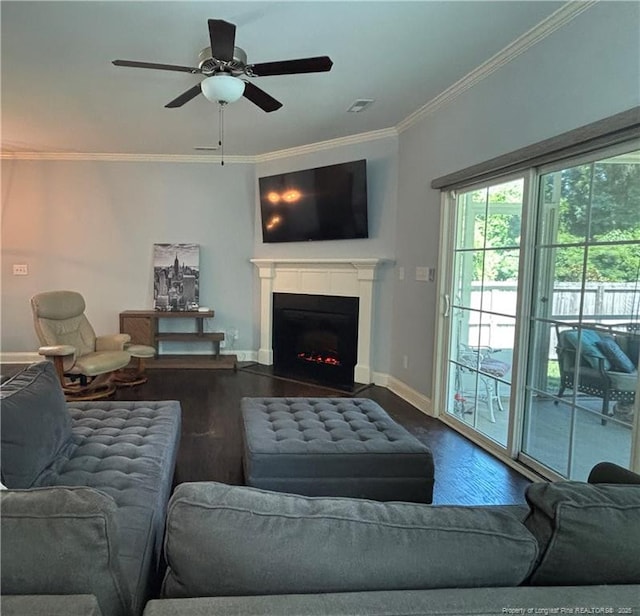 914 W Rowan St SW, Fayetteville, NC 28301 - living area with wood finished floors, ornamental molding, ceiling fan, and a fireplace with flush hearth