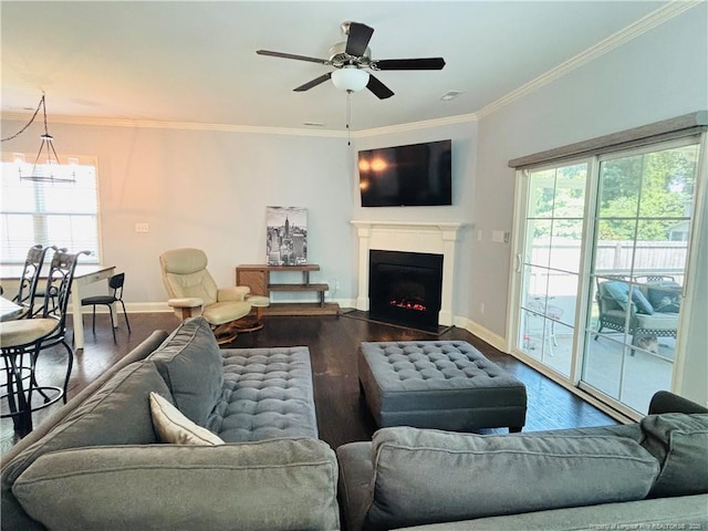 914 W Rowan St SW, Fayetteville, NC 28301 - living area featuring dark wood-style flooring, ornamental molding, a fireplace with flush hearth, and ceiling fan