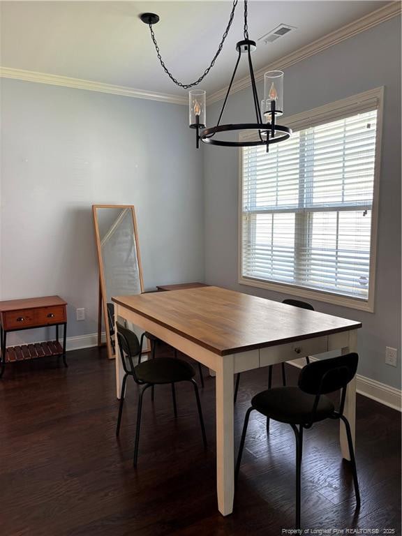 914 W Rowan St SW, Fayetteville, NC 28301 - dining space featuring a chandelier, ornamental molding, and dark wood-type flooring