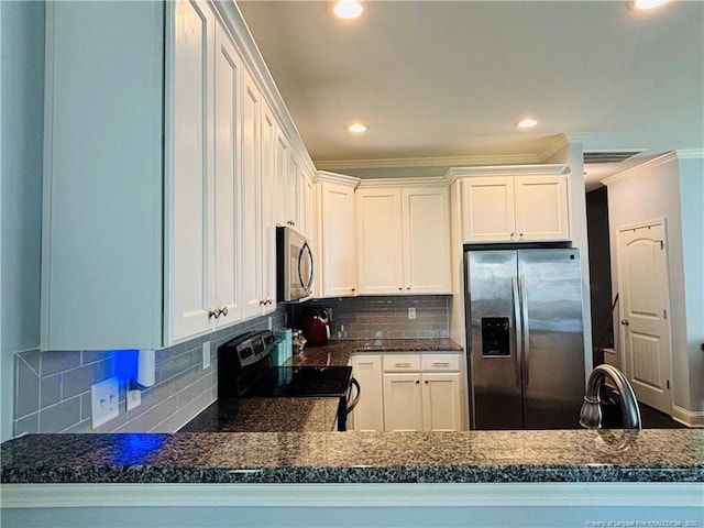 914 W Rowan St SW, Fayetteville, NC 28301 - kitchen featuring appliances with stainless steel finishes, crown molding, dark countertops, tasteful backsplash, and recessed lighting