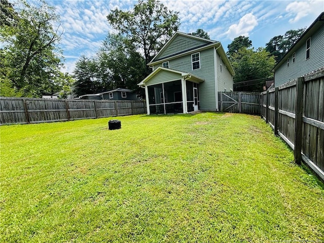 914 W Rowan St SW, Fayetteville, NC 28301 - rear view of property with a sunroom and a fenced backyard