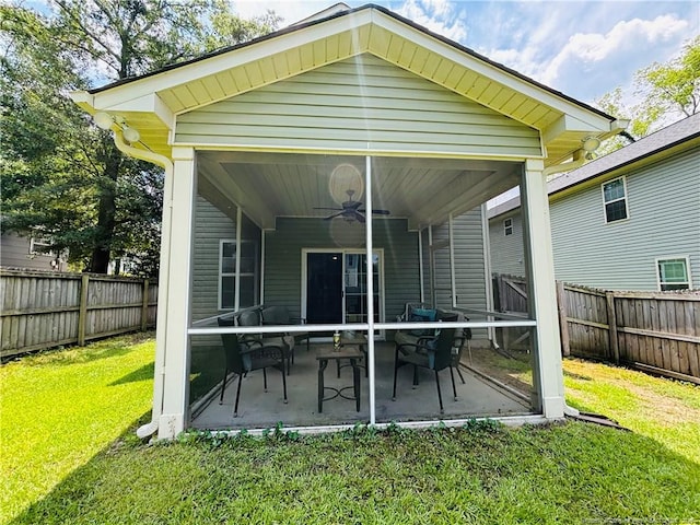 914 W Rowan St SW, Fayetteville, NC 28301 - back of property featuring ceiling fan, a fenced backyard, and a patio