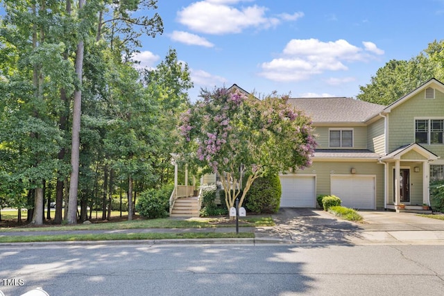 203 Bluefield Rd, Chapel Hill, NC 27517 - view of front of home featuring driveway, a garage, and roof with shingles