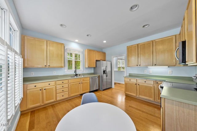 203 Bluefield Rd, Chapel Hill, NC 27517 - kitchen featuring appliances with stainless steel finishes, light brown cabinets, light wood-style floors, light countertops, and recessed lighting