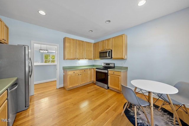 203 Bluefield Rd, Chapel Hill, NC 27517 - kitchen featuring stainless steel appliances, light wood-style floors, light countertops, recessed lighting, and light brown cabinets