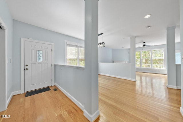 203 Bluefield Rd, Chapel Hill, NC 27517 - entrance foyer with light wood-type flooring, a ceiling fan, and ornate columns