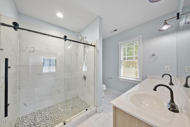 203 Bluefield Rd, Chapel Hill, NC 27517 - bathroom with a shower stall, double vanity, and tile patterned floors