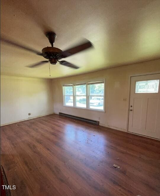 2035 Simpkins Rd, Raleigh, NC 27603 - foyer entrance featuring baseboard heating, wood finished floors, and a ceiling fan