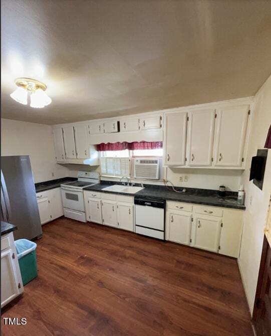 2035 Simpkins Rd, Raleigh, NC 27603 - kitchen with white appliances, dark wood finished floors, dark countertops, and white cabinetry