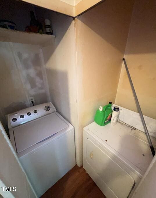 2035 Simpkins Rd, Raleigh, NC 27603 - laundry area featuring washer and dryer and wood finished floors
