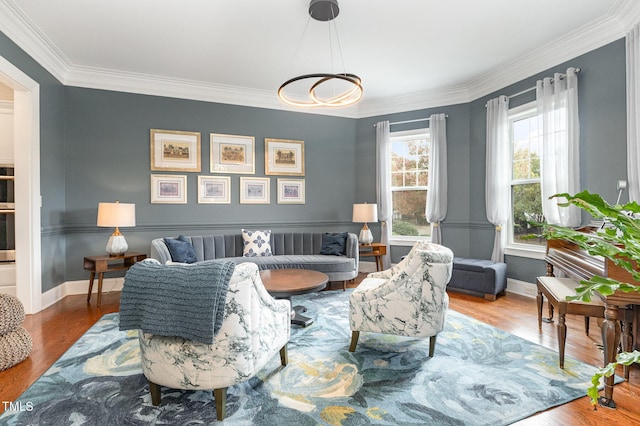 1501 Heritage Reserve Ct, Wake Forest, NC 27587 - living area with ornamental molding, wood finished floors, and a chandelier
