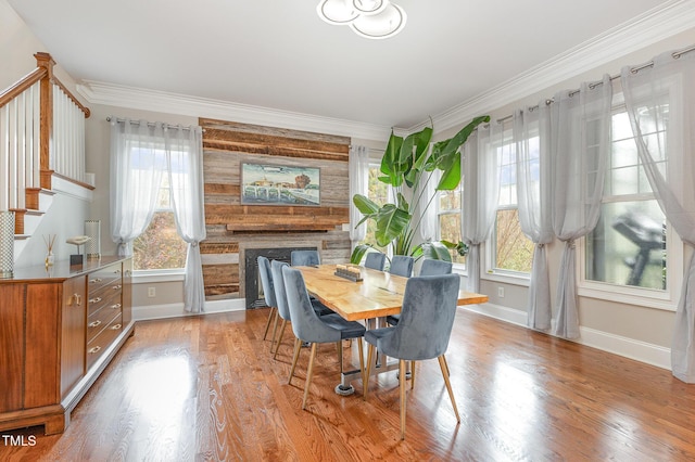 1501 Heritage Reserve Ct, Wake Forest, NC 27587 - dining area featuring plenty of natural light, stairs, wood finished floors, ornamental molding, and a fireplace