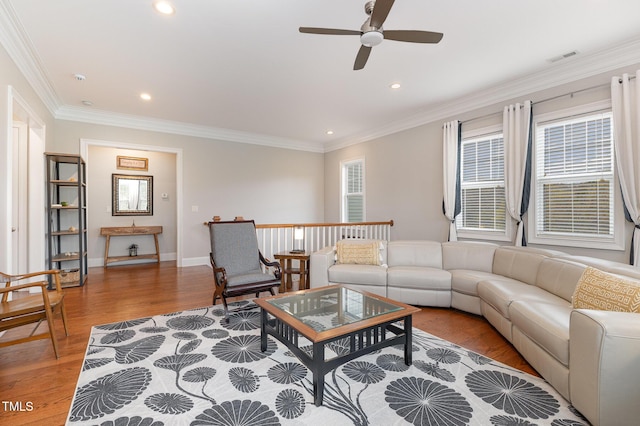 1501 Heritage Reserve Ct, Wake Forest, NC 27587 - living room with a ceiling fan, light wood-style floors, recessed lighting, and crown molding