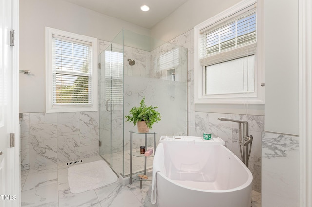 1501 Heritage Reserve Ct, Wake Forest, NC 27587 - bathroom with tile walls, a freestanding bath, a marble finish shower, marble finish flooring, and wainscoting