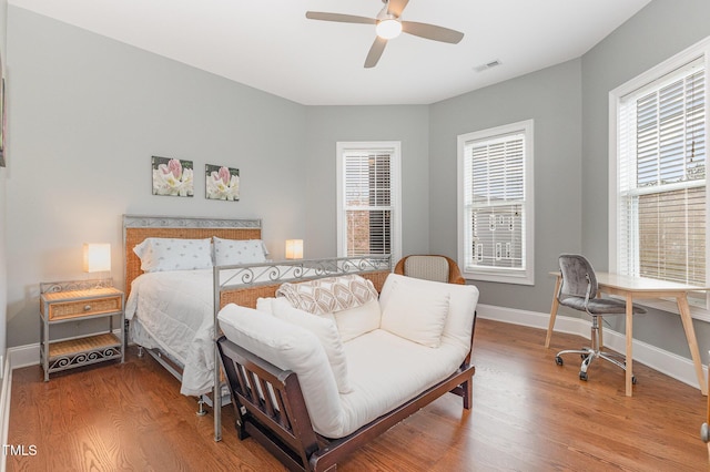 1501 Heritage Reserve Ct, Wake Forest, NC 27587 - bedroom with wood finished floors, a desk, and ceiling fan