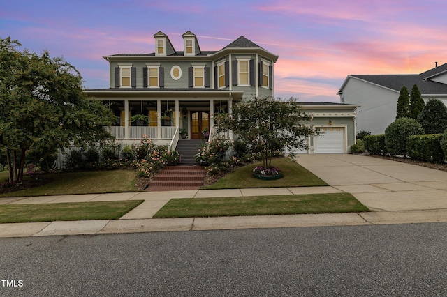 1501 Heritage Reserve Ct, Wake Forest, NC 27587 - view of front of property with driveway, a porch, an attached garage, and a front lawn