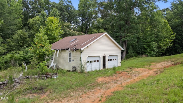 129 Shaman Dr, Louisburg, NC 27549 - view of side of property with a detached garage