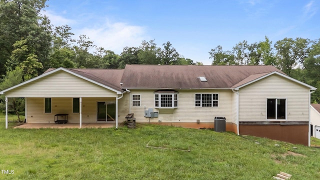 129 Shaman Dr, Louisburg, NC 27549 - back of house with a lawn and a patio