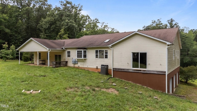 129 Shaman Dr, Louisburg, NC 27549 - back of house featuring a yard and a patio