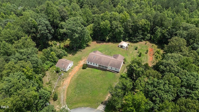 129 Shaman Dr, Louisburg, NC 27549 - view of property location featuring a heavily wooded area
