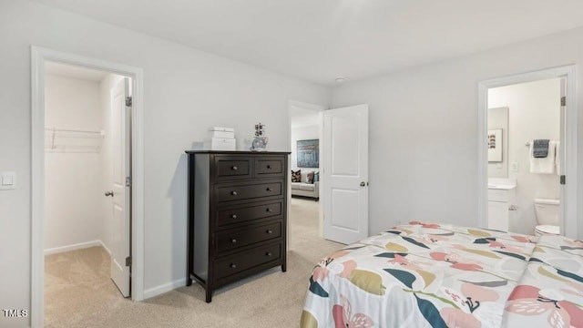 716 Holstein Dairy Way, Wake Forest, NC 27587 - bedroom with a spacious closet, light colored carpet, a closet, and connected bathroom