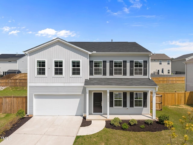 5404 Rutledgeville Ln, Knightdale, NC 27545 - traditional-style house featuring covered porch, a garage, driveway, board and batten siding, and a shingled roof