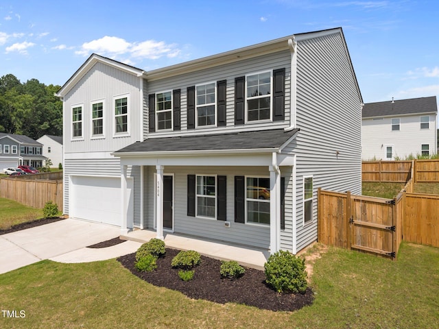 5404 Rutledgeville Ln, Knightdale, NC 27545 - traditional-style house featuring a porch, an attached garage, concrete driveway, and a gate