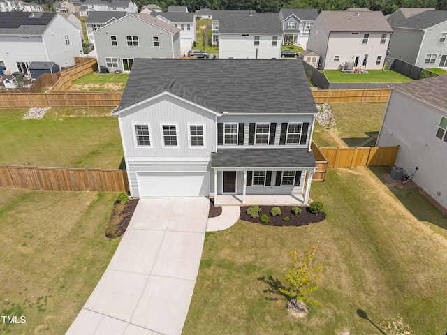 5404 Rutledgeville Ln, Knightdale, NC 27545 - view of front facade featuring a residential view, roof with shingles, an attached garage, concrete driveway, and board and batten siding