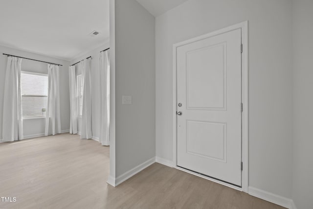 5404 Rutledgeville Ln, Knightdale, NC 27545 - entrance foyer with light wood-type flooring and baseboards