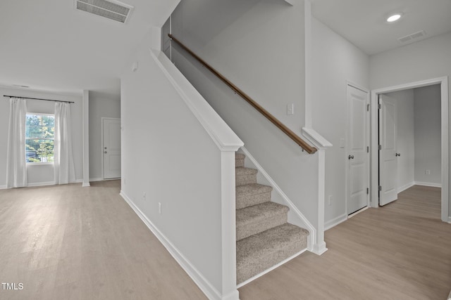 5404 Rutledgeville Ln, Knightdale, NC 27545 - stairs with wood finished floors and recessed lighting