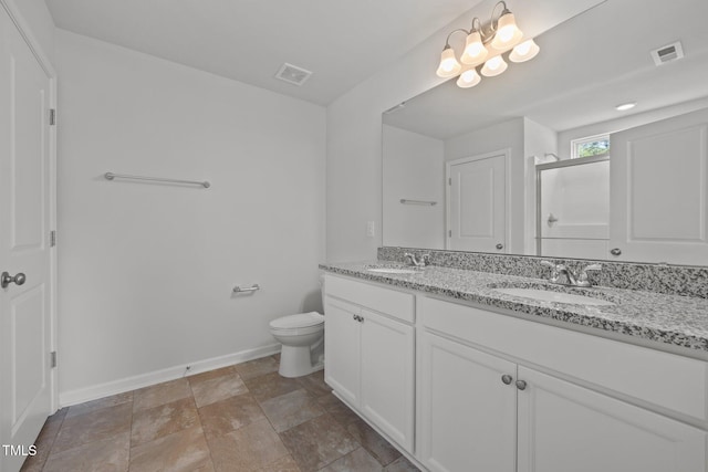5404 Rutledgeville Ln, Knightdale, NC 27545 - full bath featuring double vanity, a shower with shower door, and stone finish floors