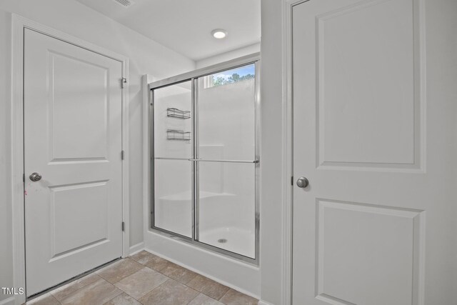 5404 Rutledgeville Ln, Knightdale, NC 27545 - full bathroom featuring a shower stall and stone finish flooring