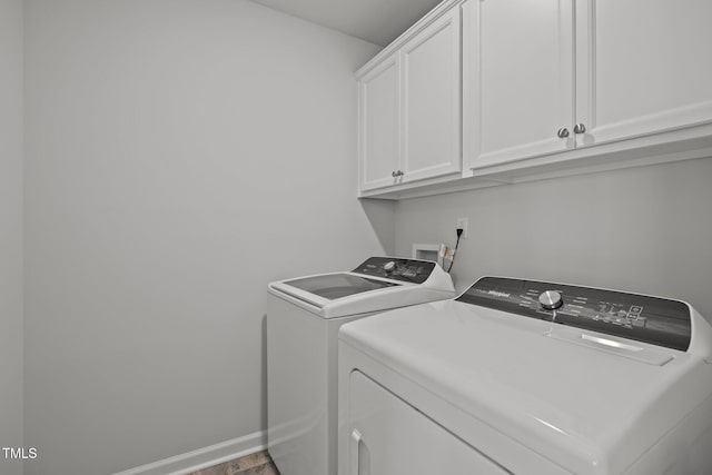 5404 Rutledgeville Ln, Knightdale, NC 27545 - laundry area featuring washer and clothes dryer and cabinet space