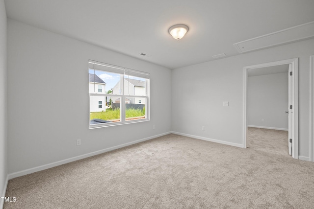5404 Rutledgeville Ln, Knightdale, NC 27545 - carpeted spare room with attic access and baseboards